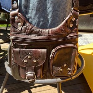 Authentic beautiful leather crossbody bag. Incredible soft to the touch. New.